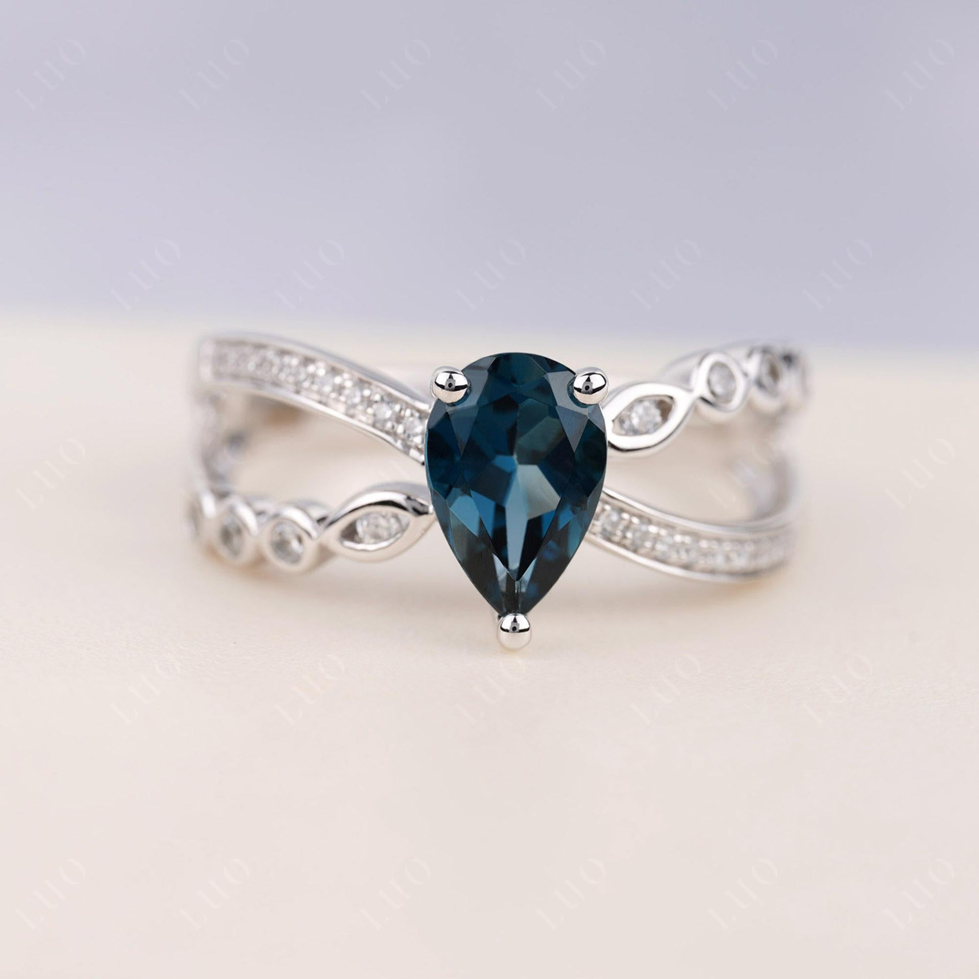 Pear Shaped London Blue Topaz Crossover Ring - LUO Jewelry