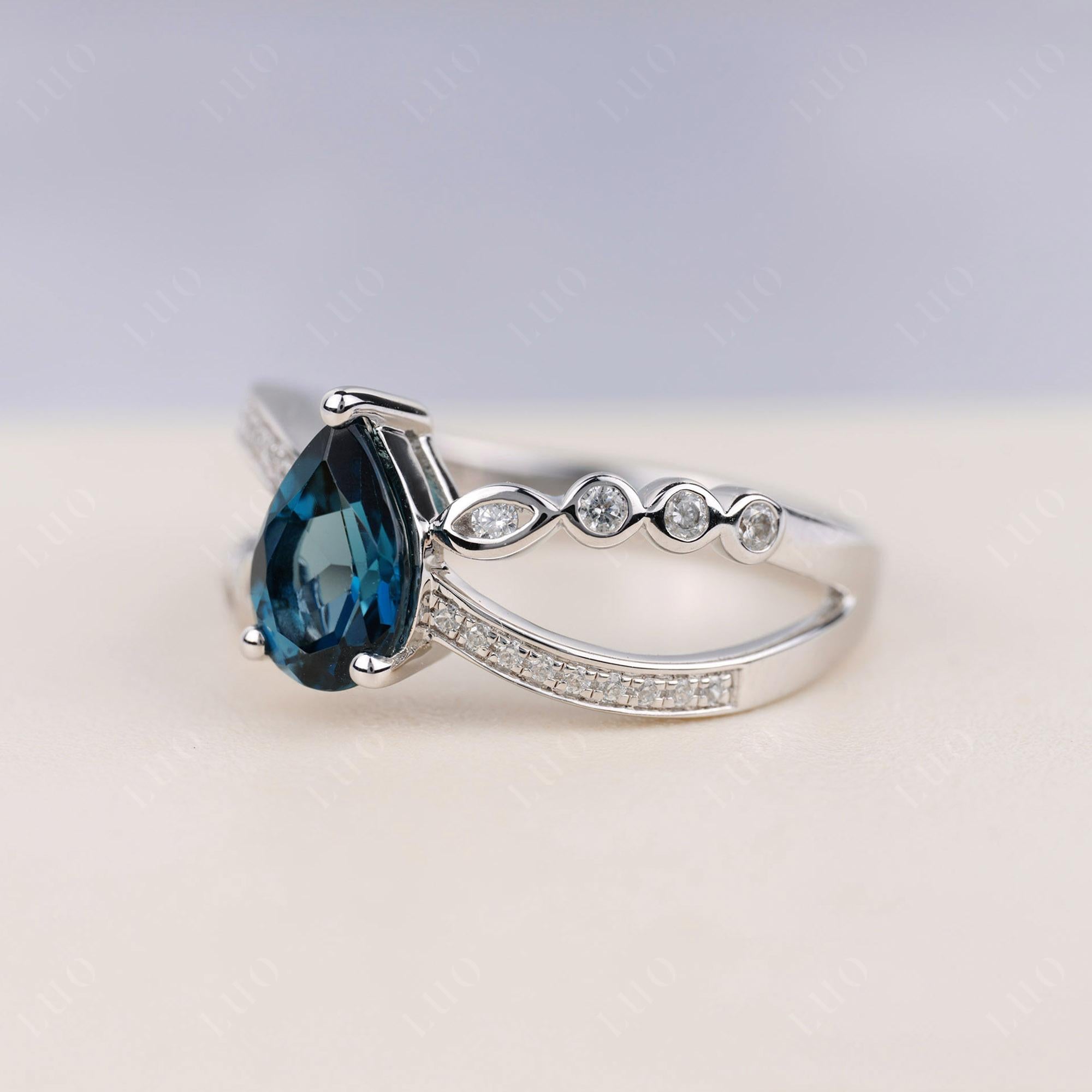 Pear Shaped London Blue Topaz Crossover Ring - LUO Jewelry