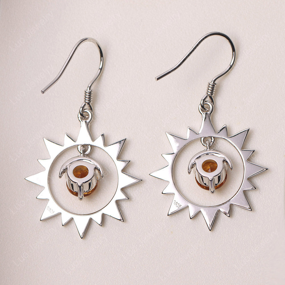 Orecchini pendenti con sole e luna in citrino