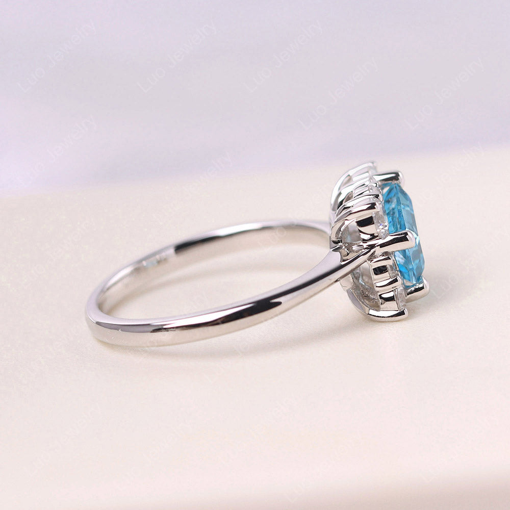 Smaragd geschnittener Schweizer blauer Topas Halo Ring