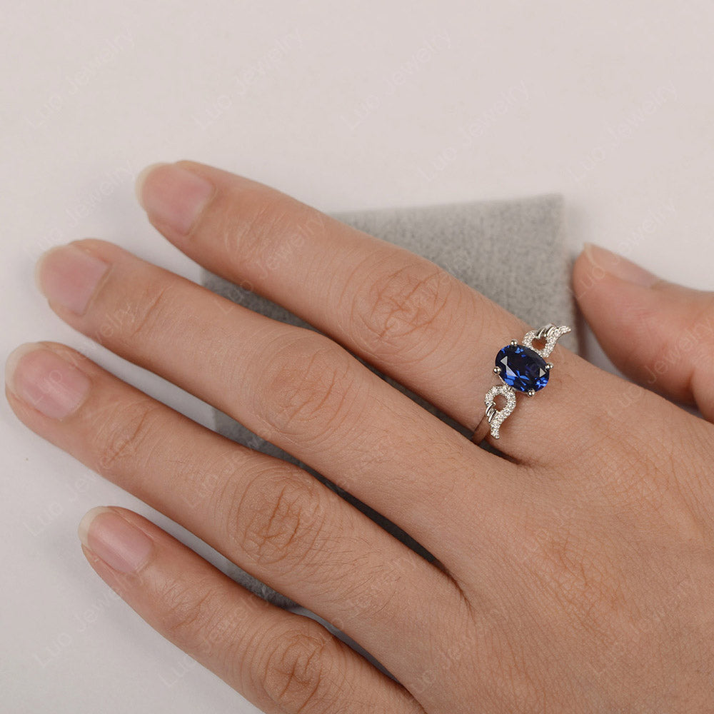 Oval Sapphire Angel Wing Ring