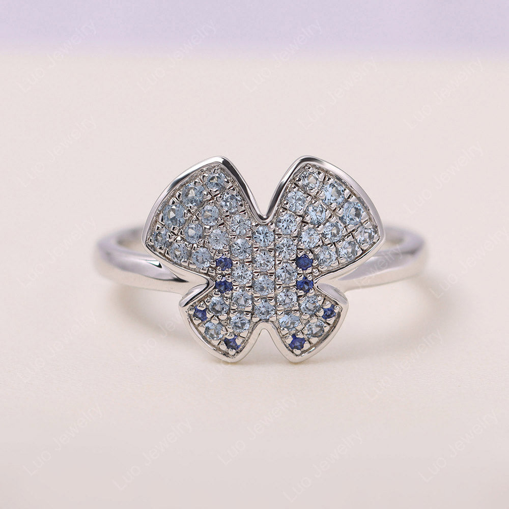 Schmetterlingsförmiger Pavé-Ring mit blauem Zirkonia und Saphir