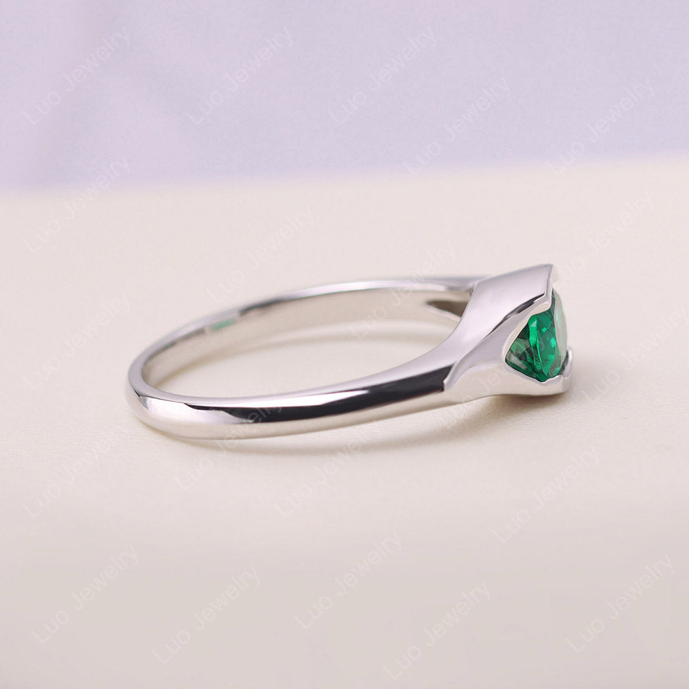 Oval Emerald East West Bezel Set Ring