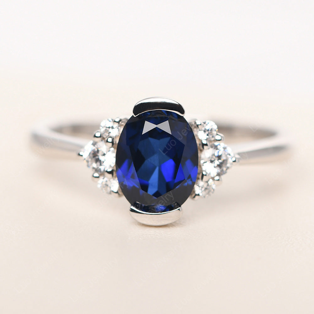 Oval Half Bezel Set Lab Sapphire Engagement Ring - LUO Jewelry