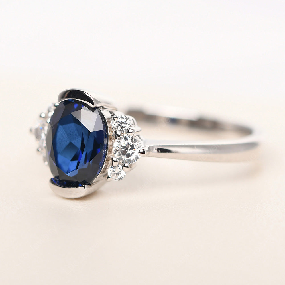 Oval Half Bezel Set Lab Sapphire Engagement Ring - LUO Jewelry