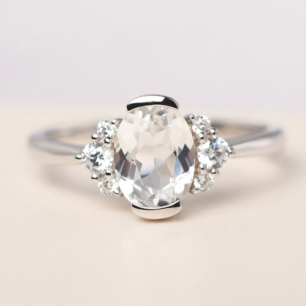 Oval Half Bezel Set White Topaz Engagement Ring - LUO Jewelry
