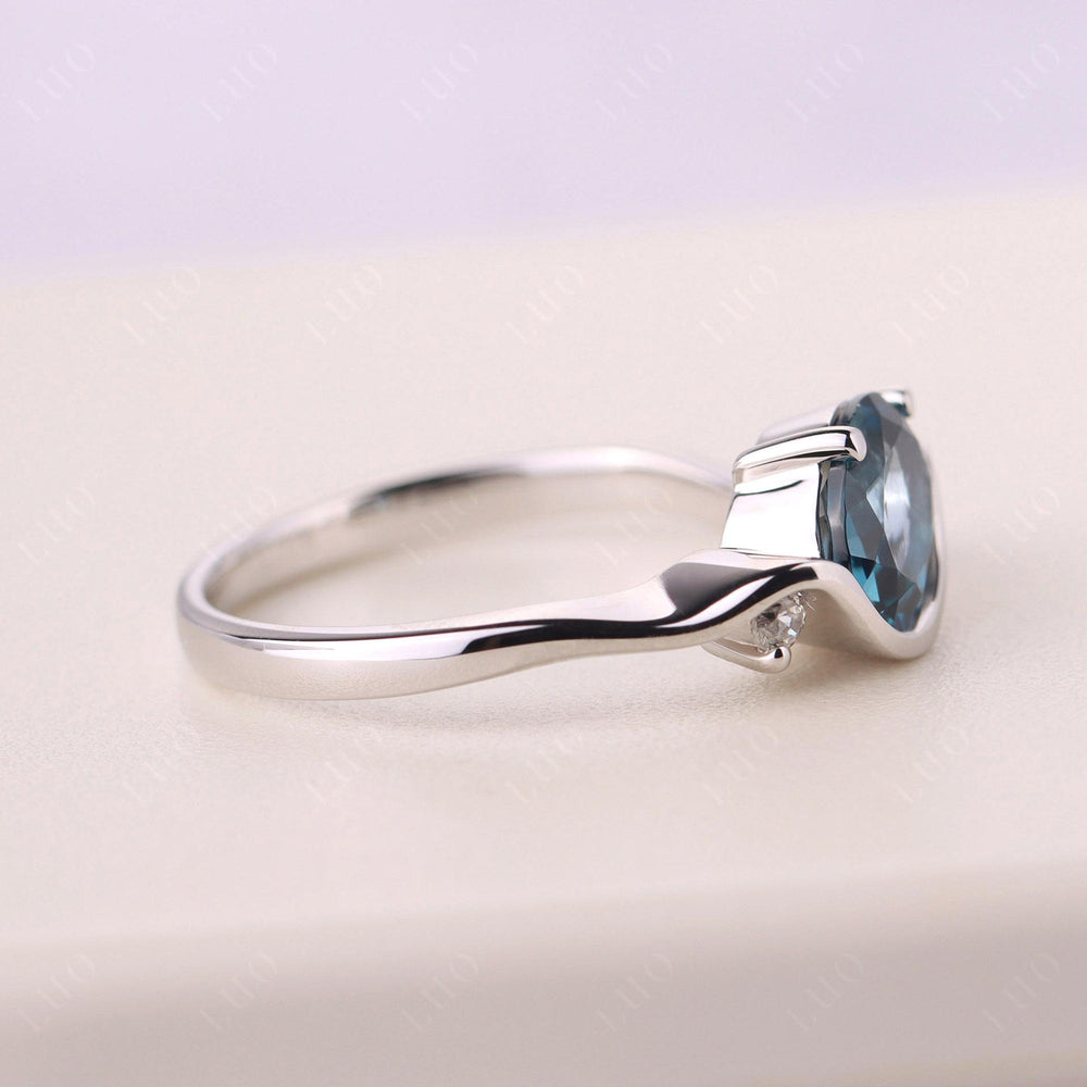 Wave Oval London Blue Topaz Engagement Ring