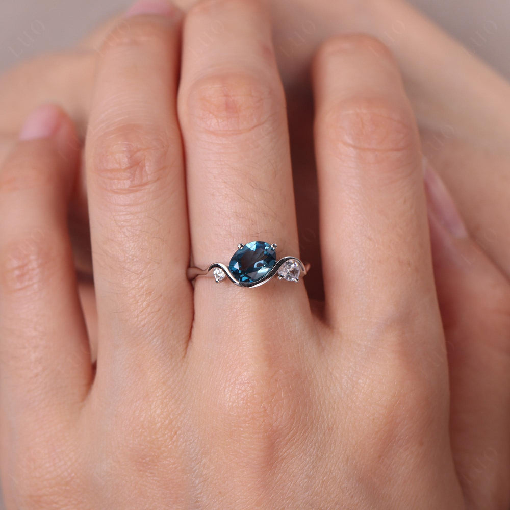 Wave Oval London Blue Topaz Engagement Ring