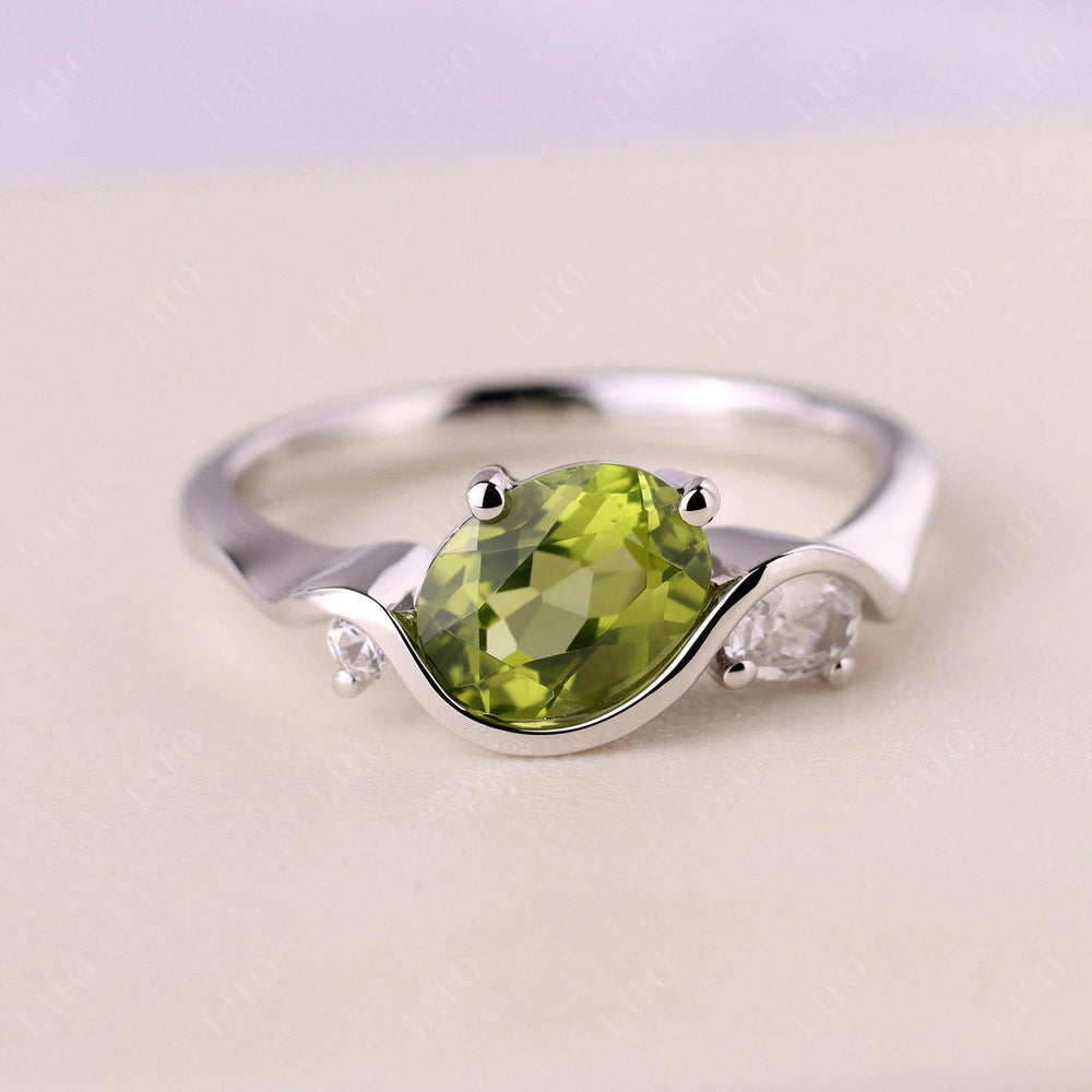 Wave Oval Peridot Engagement Ring
