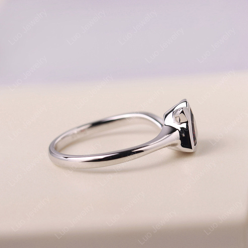Cat Trillion Cut Garnet Bezel Ring