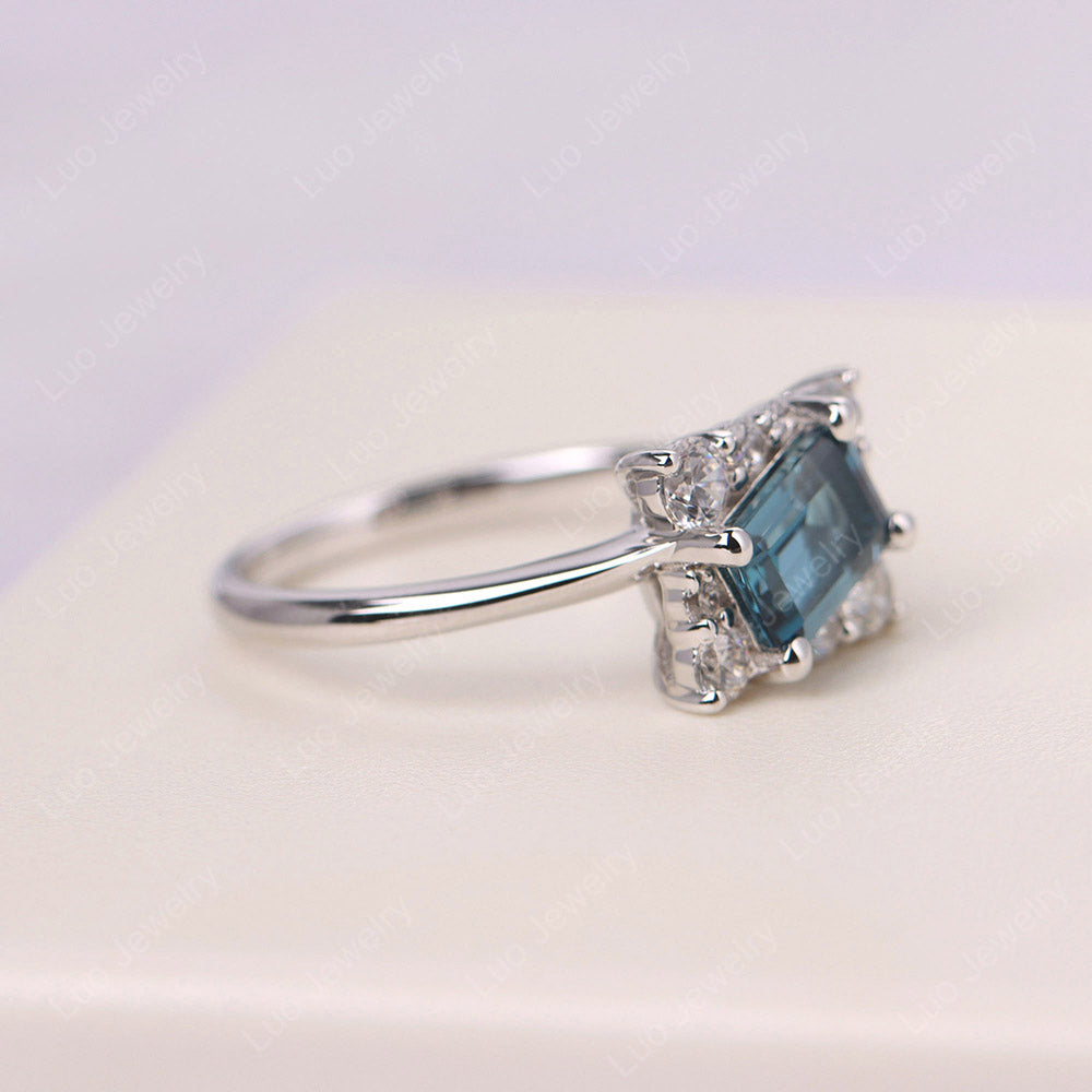 Anillo Emerald Cut London Blue Topaz Halo