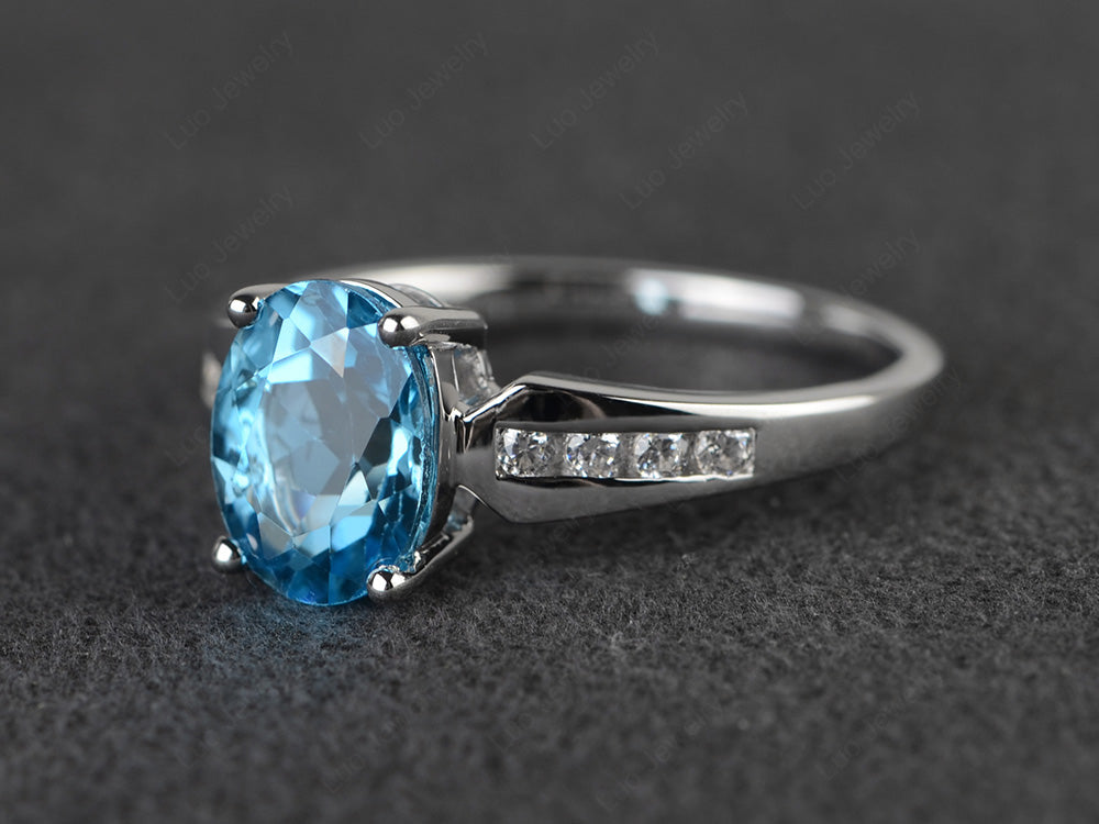 Oval Cut Swiss Blue Topaz Ring With Channel Set Band - LUO Jewelry