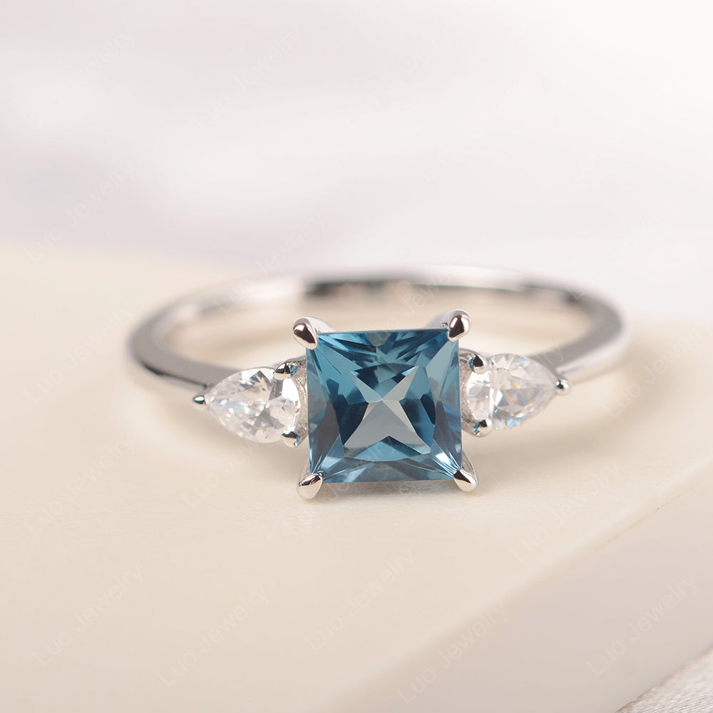 Princess Cut London Blue Topaz Ring With Pear Side Stone - LUO Jewelry