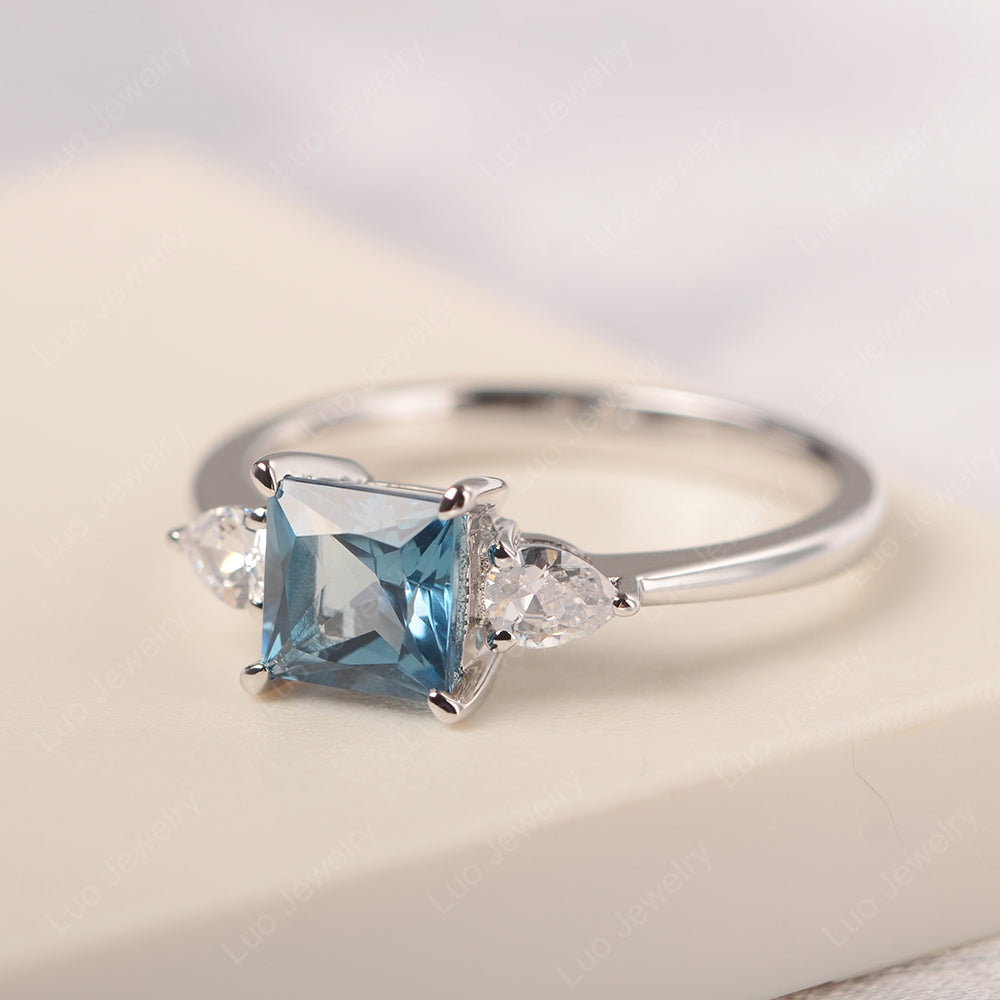 Princess Cut London Blue Topaz Ring With Pear Side Stone - LUO Jewelry